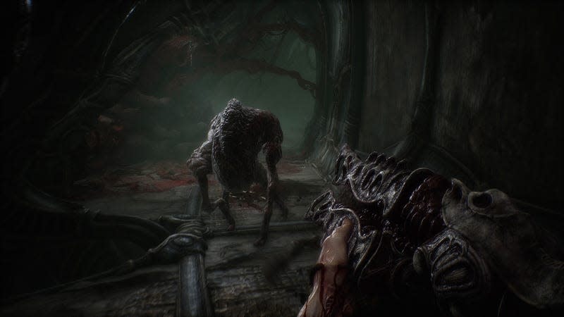 An alien gun is aimed at a weird-looking creature in Scorn. 