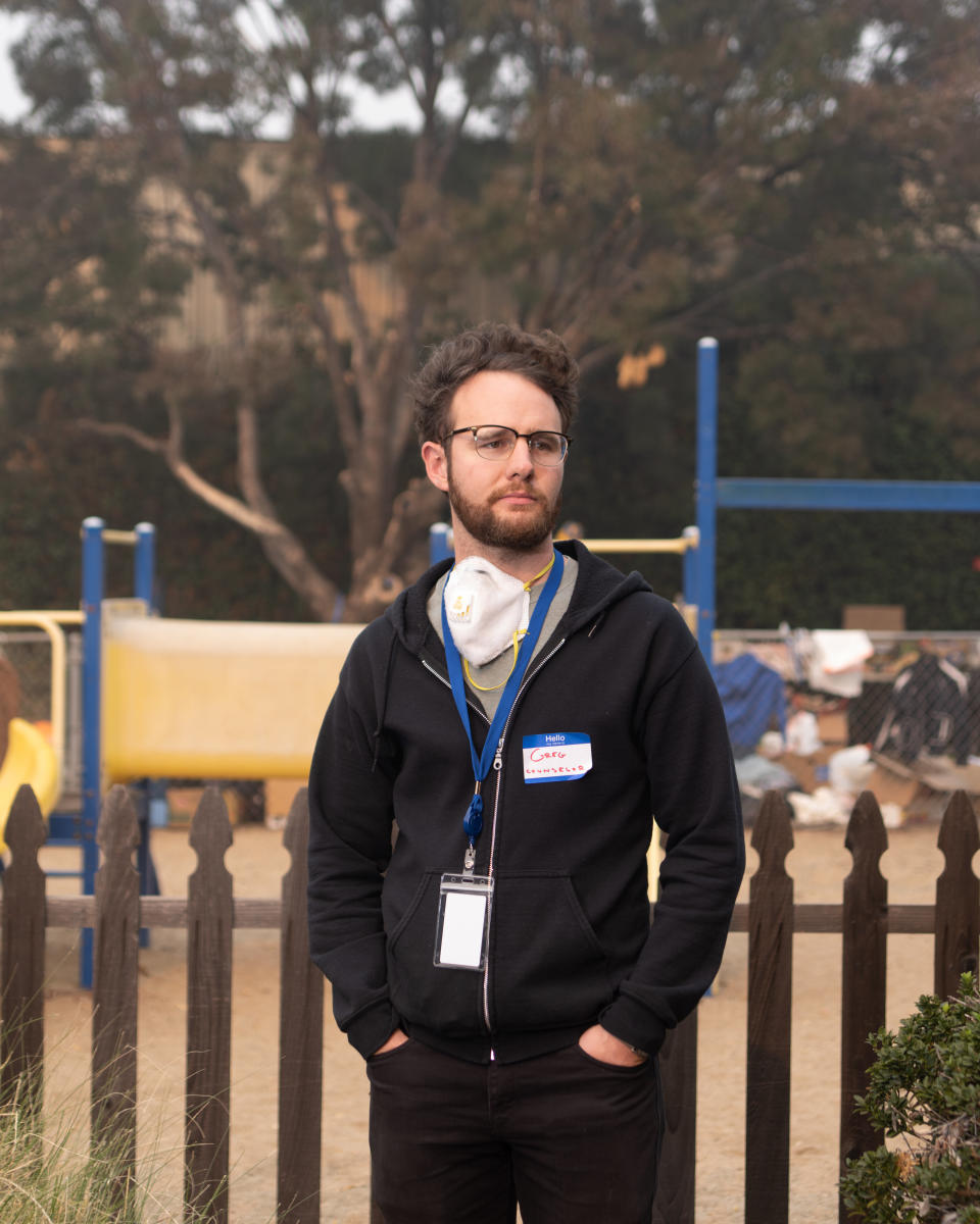 Greg Shafer, a behavioral health counselor with Butte County, does welfare checks on East Ave Shelter evacuees.&nbsp; (Photo: Cayce Clifford for HuffPost)