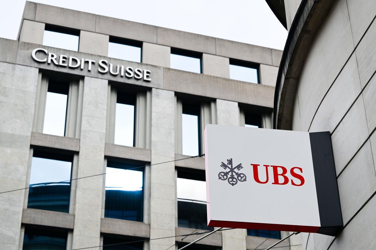 A sign of UBS  is seen on a  building in Geneva, on 18 February 2024