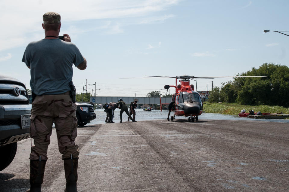 A helicopter transports&nbsp;a man who had been waiting two days to be rescued in Port Arthur.