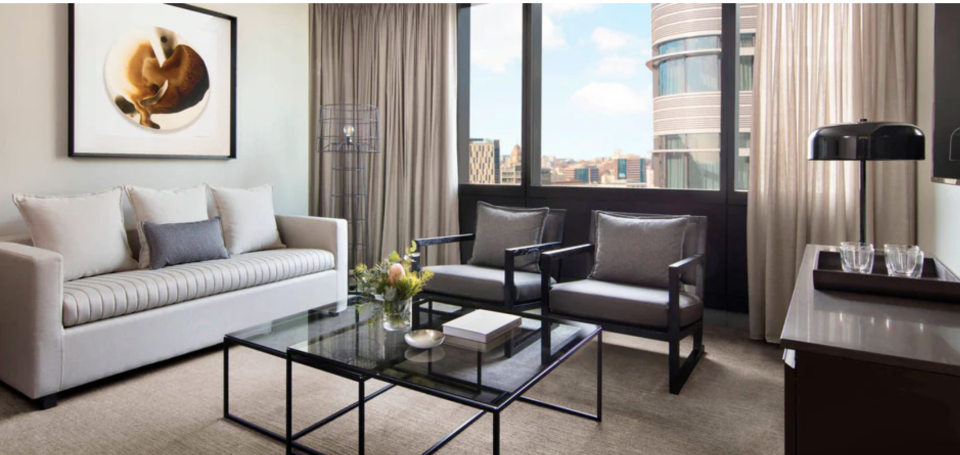 A living area in a room of The Four Points by Sheraton looking out over the CBD