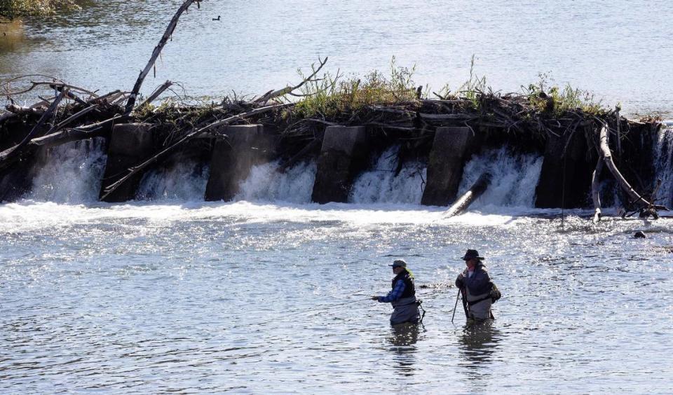 Richard Seltzer of Caldwell, left, fly fishes for the first time with guidance from Tom Old of Meridian, right, during a retreat with Idaho2Fly on the Boise River on Oct. 9. Idaho2Fly is a nonprofit that helps men with cancer connect with one another over fly fishing.