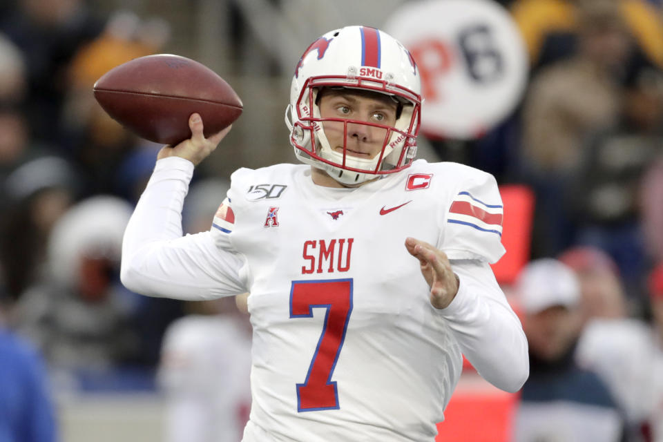 SMU quarterback Shane Buechele throws a pass against Navy during the first half of an NCAA college football game, Saturday, Nov. 23, 2019, in Annapolis, Md. (AP Photo/Julio Cortez)