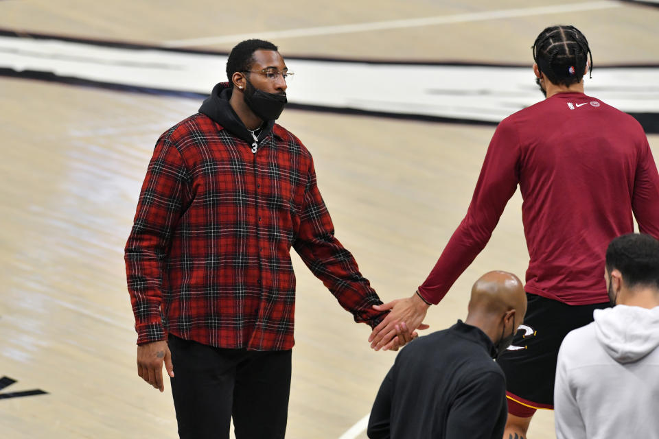 Andre Drummond #3 celebrates with JaVale McGee #6 of the Cleveland Cavaliers during a timeout during the second quarter against the Denver Nuggets at Rocket Mortgage Fieldhouse on February 19, 2021 in Cleveland, Ohio. NOTE TO USER: User expressly acknowledges and agrees that, by downloading and/or using this photograph, user is consenting to the terms and conditions of the Getty Images License Agreement. (Photo by Jason Miller/Getty Images)