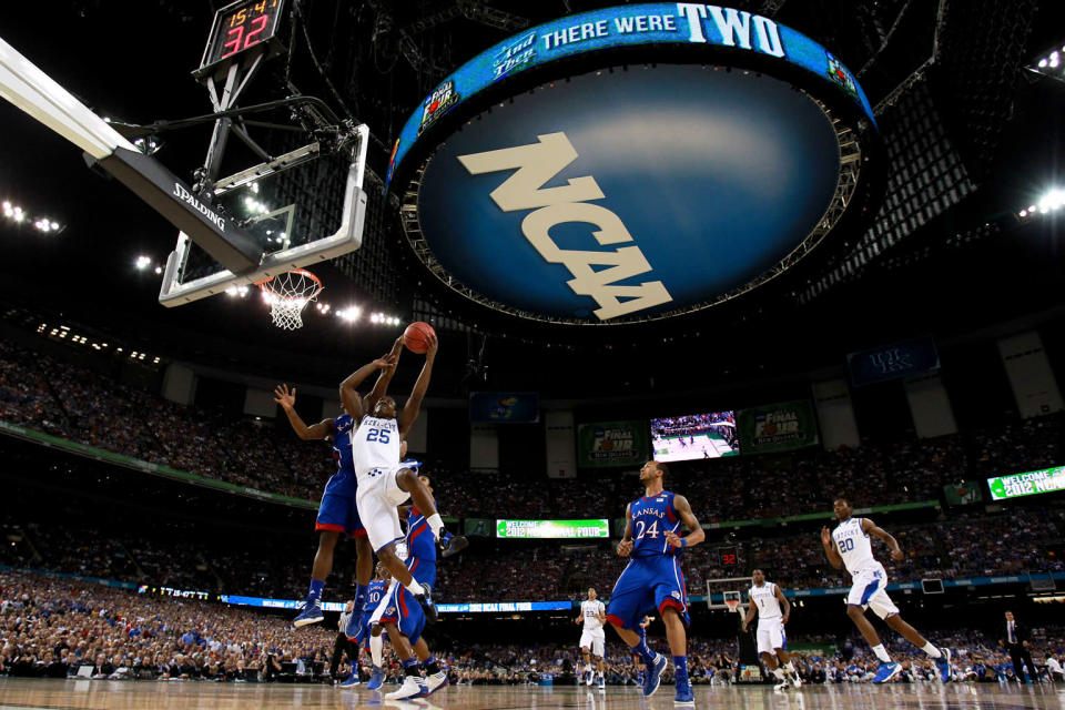 Marquis Teague #25 of the Kentucky Wildcats lays the ball up against Elijah Johnson #15 of the Kansas Jayhawks in the first half in the National Championship Game of the 2012 NCAA Division I Men's Basketball Tournament at the Mercedes-Benz Superdome on April 2, 2012 in New Orleans, Louisiana. (Photo by Ronald Martinez/Getty Images)