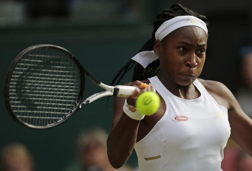 United States' Cori "Coco" Gauff returns to Slovenia's Polona Hercog in a Women's singles match during day five of the Wimbledon Tennis Championships in London, Friday, July 5, 2019. (AP Photo/Ben Curtis)