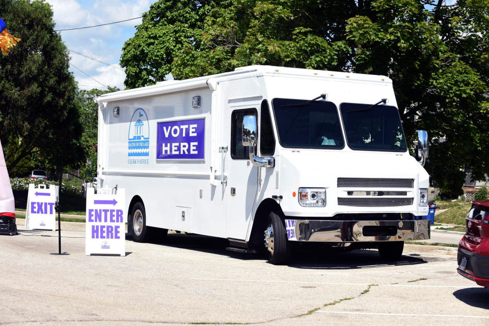 FILE - The City of Racine Clerk's Office mobile voting van is seen on July 26, 2022, at the Dr. Martin Luther King Community Center in Racine, Wis. The Wisconsin Supreme Court late Tuesday, June 11, kept in place for now a lower court's ruling banning the use of mobile voting sites in the upcoming presidential election, a win for Republicans. (Ryan Patterson/The Journal Times via AP, File)