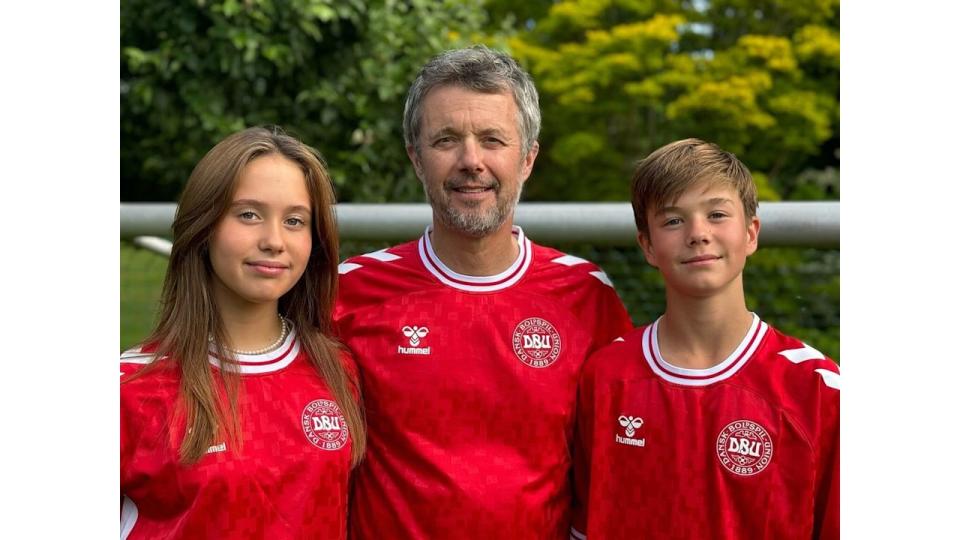 King Frederik with Princess Josephine and Prince Vincent in red Danish football tops