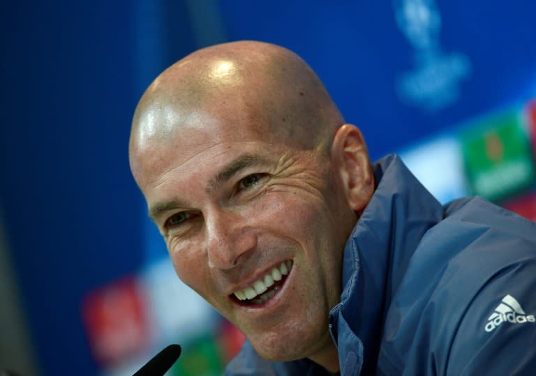 Real Madrid's French coach Zinedine Zidane smiles during a press conference at Valdebebas Sport City in Madrid on May 1, 2017