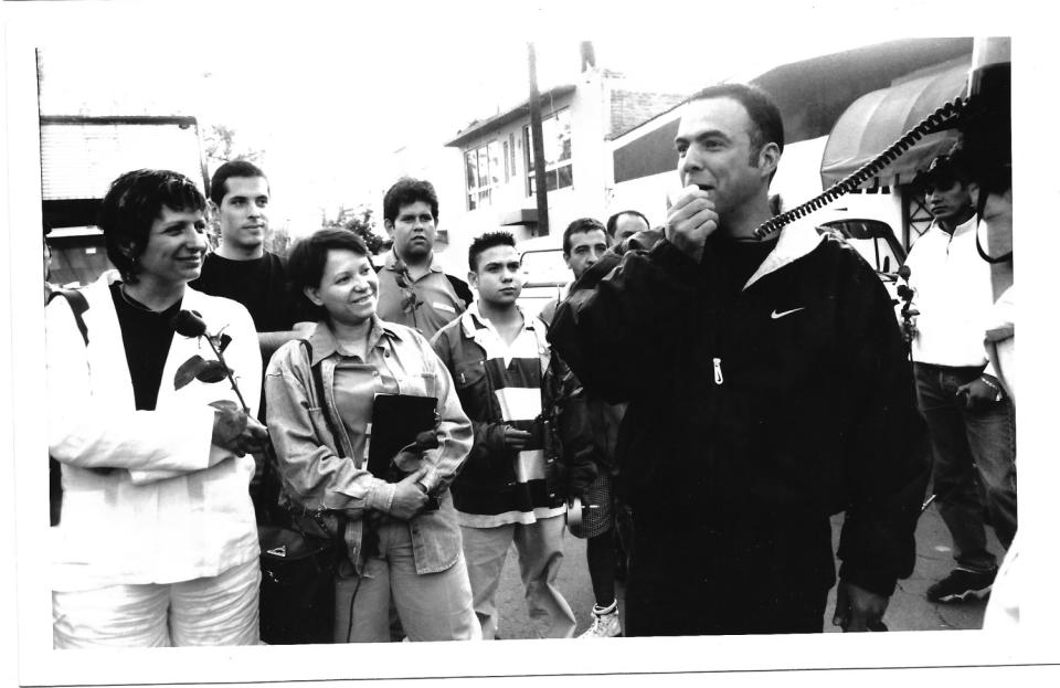 Alejandro González Iñárritu, right, appears with the cast and crew of 'Amores Perros.' At center is actress Adriana Barraza.