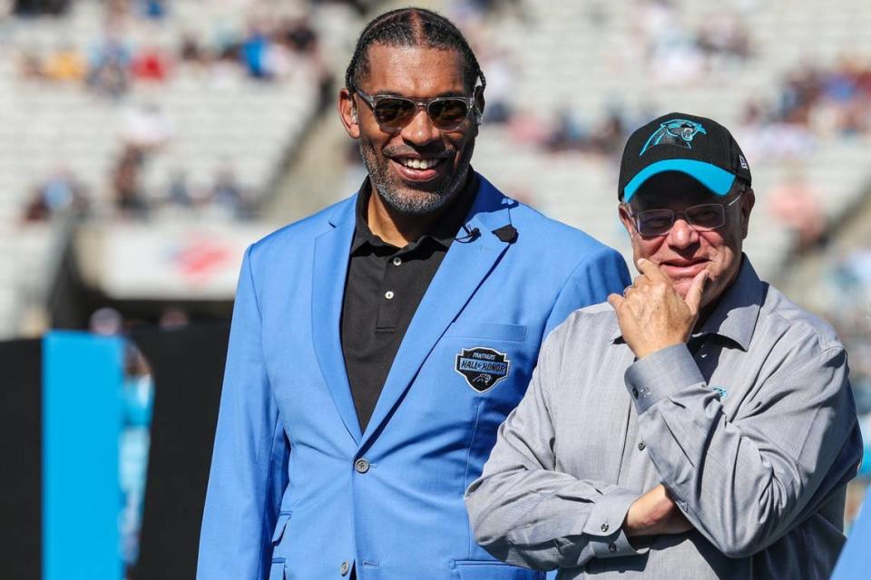 Panthers legend Julius Peppers, left, team owner David Tepper, at the Panthers Hall of Honor induction ceremony at halftime at Bank of America Stadium on Sunday, October 29, 2023.