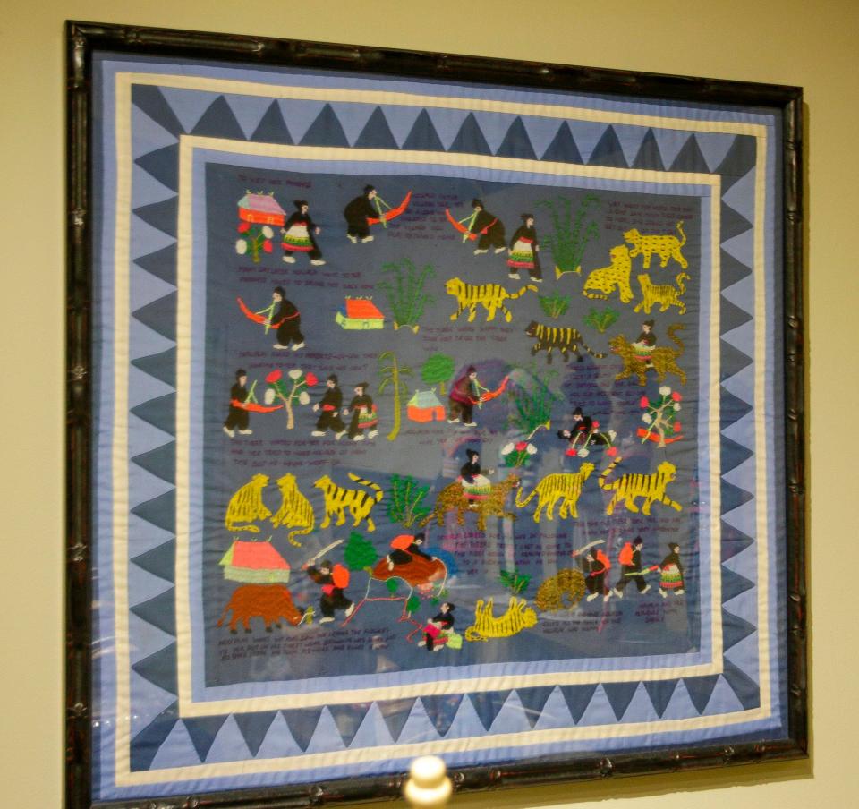 A Hmong tapestry on the wall at the new Cultural Exchange exhibit at the Above and Beyond Children’s Museum, Tuesday, May 16, 2023, in Sheboygan, Wis.