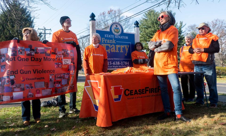 CeaseFirePA's vigil to remember gun violence victims and to mark 200 Days of Pennsylvania Senate inaction on bipartisan gun safety bills outside Sen. Frank Ferry's office in Langhorne on Friday, Dec. 8, 2023.

[Daniella Heminghaus | Bucks County Courier Times]