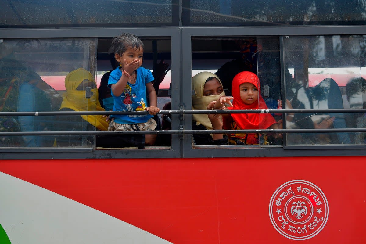 Passengers on board a state bus ferrying workers to their hometowns in Bengaluru (AFP via Getty Images)