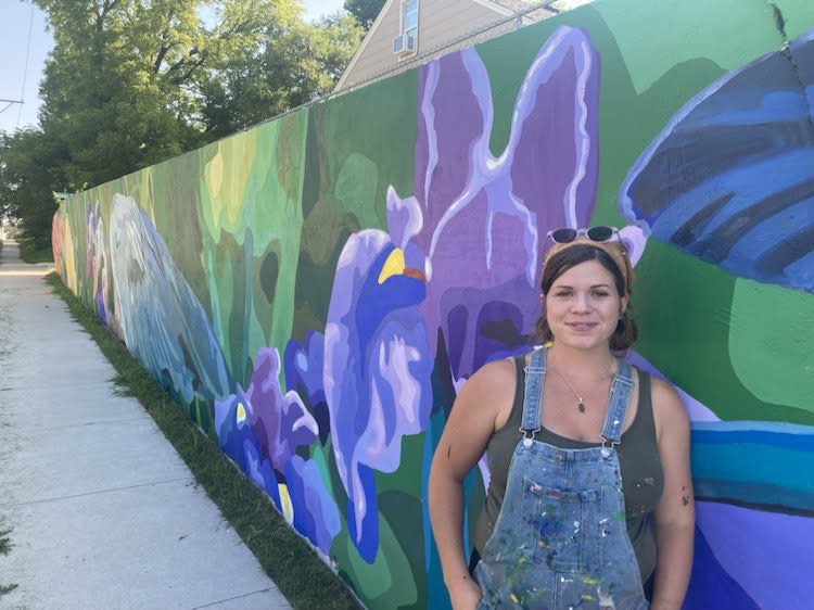 Atlanta Dawn and her mural on 18th Street in Bettendorf, July 2023.