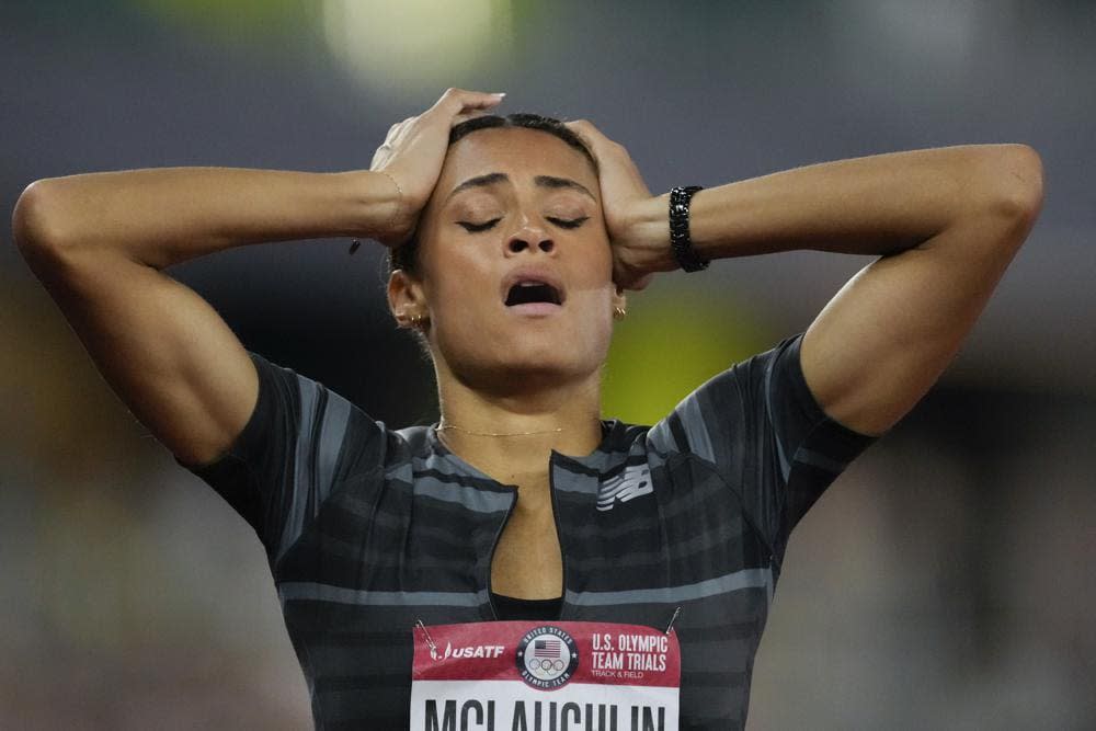 Sydney McLaughlin reacts after setting a new world record in the finals of the women’s 400-meter hurdles at the U.S. Olympic Track and Field Trials Sunday, June 27, 2021, in Eugene, Ore. (AP Photo/Ashley Landis)