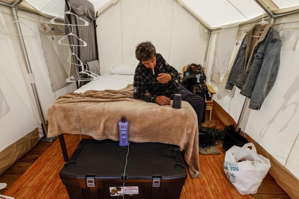 Armando Darnas inside a tent