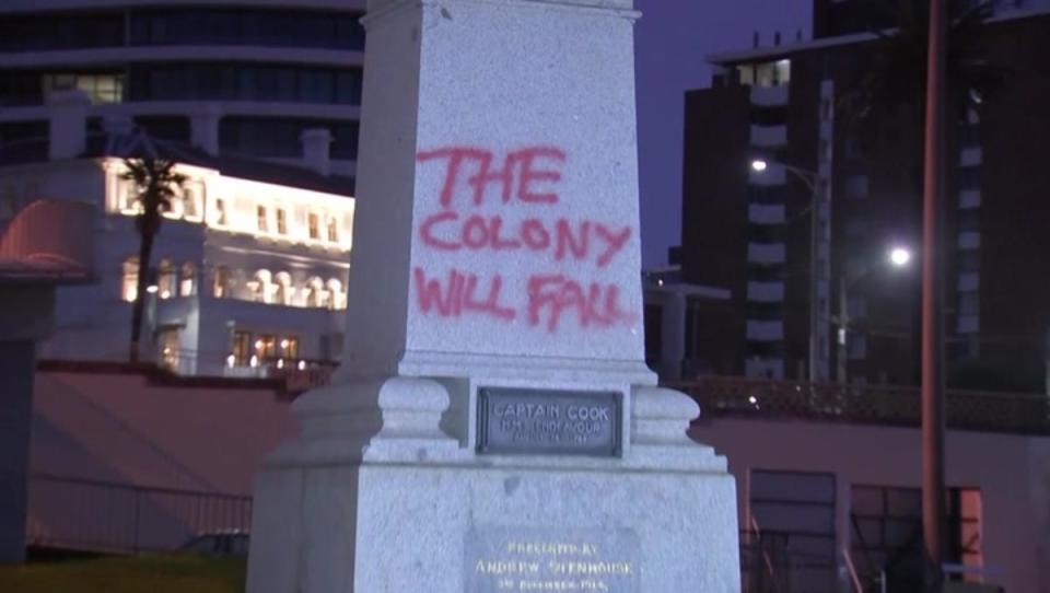 Graffiti on the plinth of the Captain Cook statue (AP)