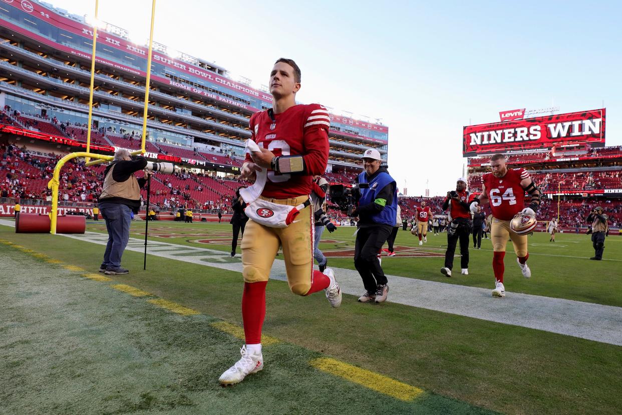 San Francisco 49ers quarterback Brock Purdy (13) runs off the field after an NFL football game against the Tampa Bay Buccaneers, Sunday, Nov. 19, 2023, in Santa Clara, Calif. (AP Photo/Scot Tucker)