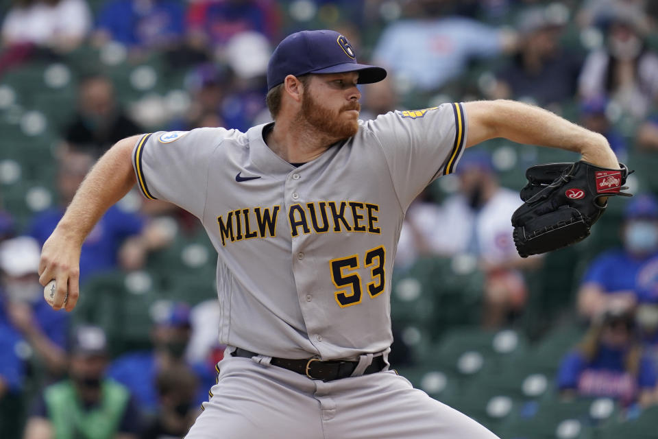 Milwaukee Brewers starting pitcher Brandon Woodruff (53) throws against the Chicago Cubs during the first inning of a baseball game in Chicago, Wednesday, April 7, 2021. (AP Photo/Nam Y. Huh)