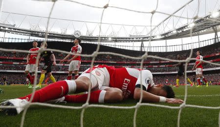 Britain Football Soccer - Arsenal v Manchester City - Premier League - Emirates Stadium - 2/4/17 Arsenal players look dejected after Manchester City's Sergio Aguero scores their second goal Reuters / Eddie Keogh Livepic