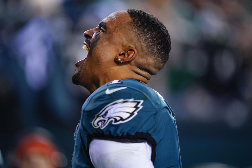 Philadelphia Eagles quarterback Jalen Hurts celebrates as he leaves the field after an NFL football game against the Washington Football Team, Tuesday, Dec. 21, 2021, in Philadelphia. (AP Photo/Matt Rourke)