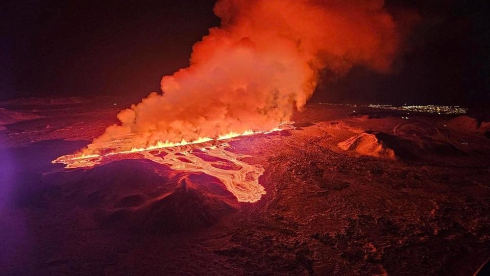 A volcano spews lava and smoke as it erupts, near Grindavik, on Reykjanes Peninsula (Reuters)