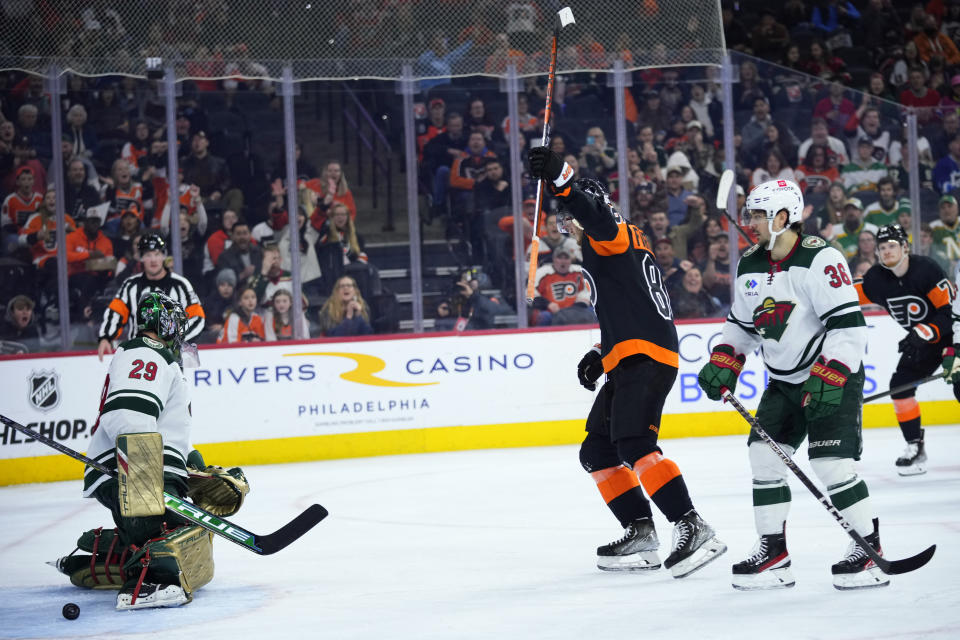 Philadelphia Flyers' Joel Farabee, center, celebrates after scoring a goal against Minnesota Wild's Marc-Andre Fleury, left, and Mats Zuccarello during the second period of an NHL hockey game, Thursday, March 23, 2023, in Philadelphia. (AP Photo/Matt Slocum)