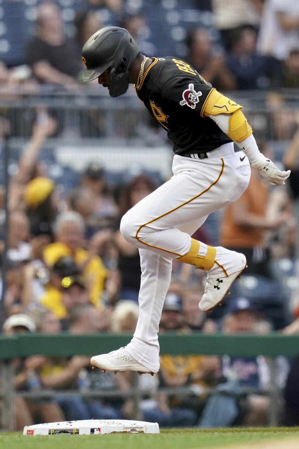 Pittsburgh Pirates' Liover Peguero crosses third base as he heads home after hitting a two-run home run against the Detroit Tigers in the second inning of a baseball game in Pittsburgh, Tuesday, Aug. 1, 2023. (AP Photo/Matt Freed)