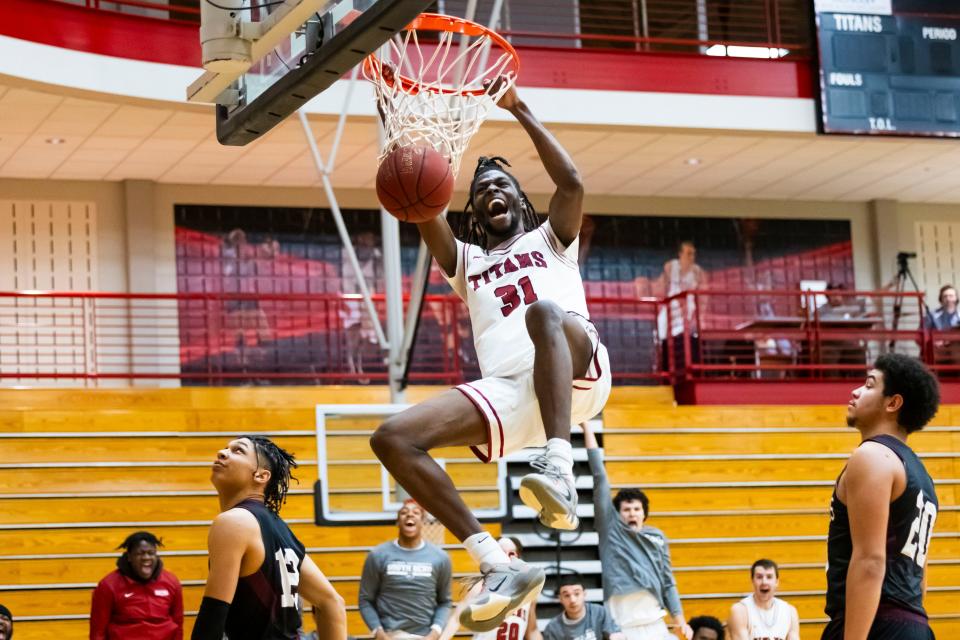 IU South Bend’s Dejon Barney (31) dunks during the IUSB vs. Holy Cross men’s basketball game Wednesday, Jan. 25, 2024 on campus at IU South Bend. (Photo courtesy of IU South Bend)