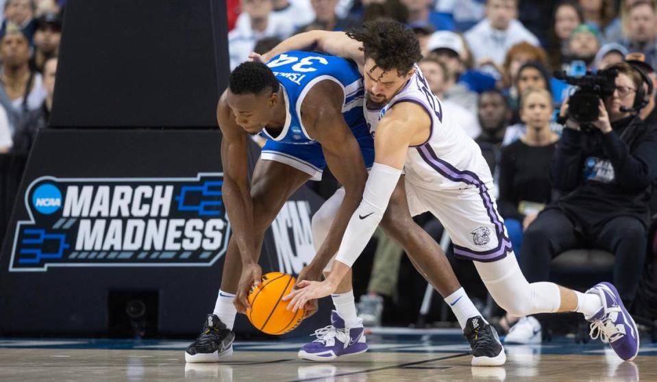 Kansas State’s Ismael Massoud fouls Kentucky’s Oscar Tshiebwe during the second half of their second round NCAA Tournament game in Greensboro, NC on Sunday.