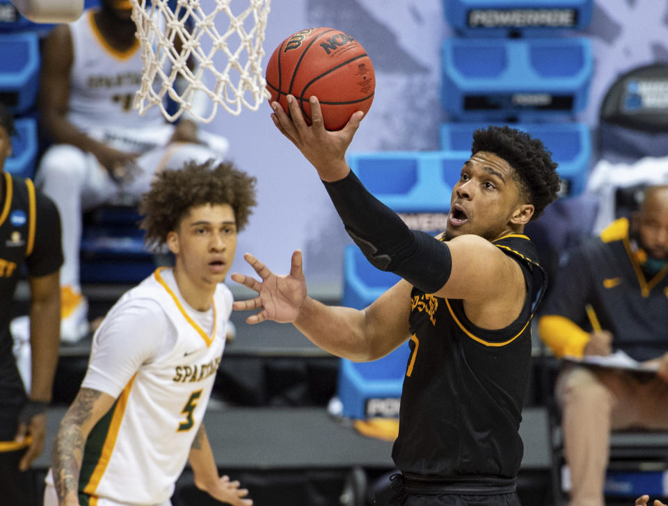 Appalachian State guard Justin Forrest (1) drives to the basket to score with a layup during the first half of a First Four game against Norfolk State in the NCAA men's college basketball tournament, Thursday, March 18, 2021, in Bloomington, Ind. (AP Photo/Doug McSchooler)