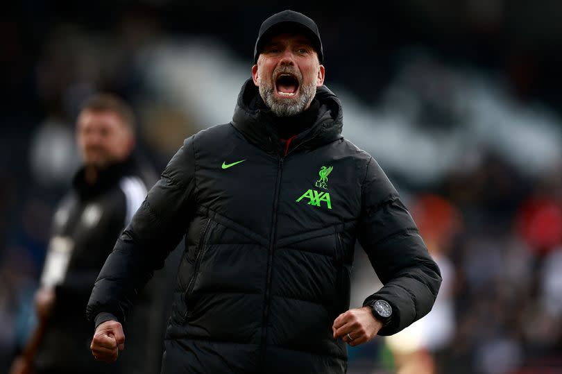 Liverpool's German manager Jurgen Klopp celebrates after the English Premier League football match between Fulham and Liverpool at Craven Cottage in London on April 21, 2024. Liverpool won the match 3-0. (Photo by BENJAMIN CREMEL / AFP) / RESTRICTED TO EDITORIAL USE. No use with unauthorized audio, video, data, fixture lists, club/league logos or 'live' services. Online in-match use limited to 120 images. An additional 40 images may be used in extra time. No video emulation. Social media in-match use limited to 120 images. An additional 40 images may be used in extra time. No use in betting publications, games or single club/league/player publications. /  (Photo by BENJAMIN CREMEL/AFP via Getty Images)