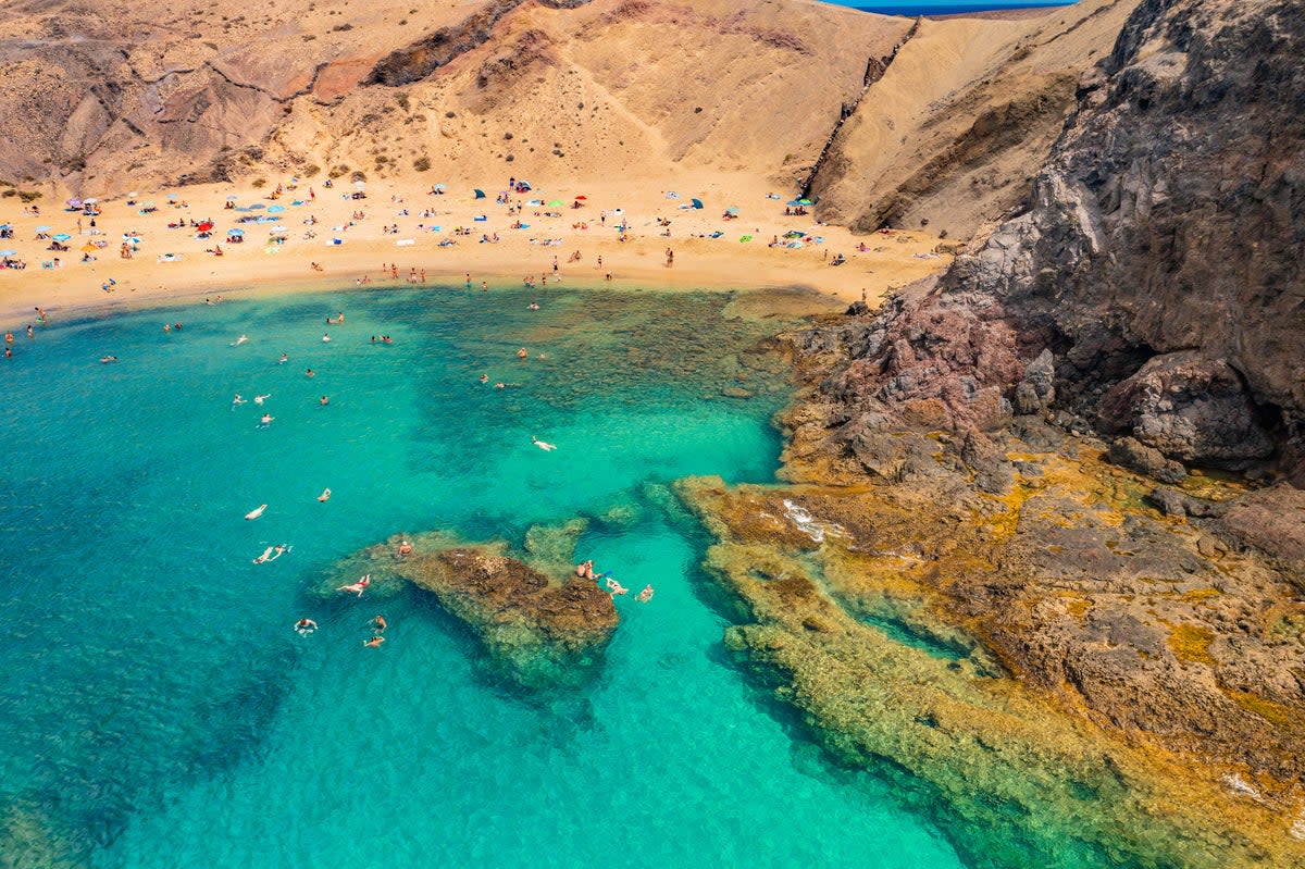 The emerald Atlantic laps Lanzarote’s golden swathes   (Getty Images)
