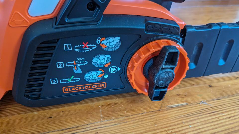 Image showing a close up of the built-in tension tool on the BLACK + DECKER 40V MAX 12-inch Cordless Chainsaw