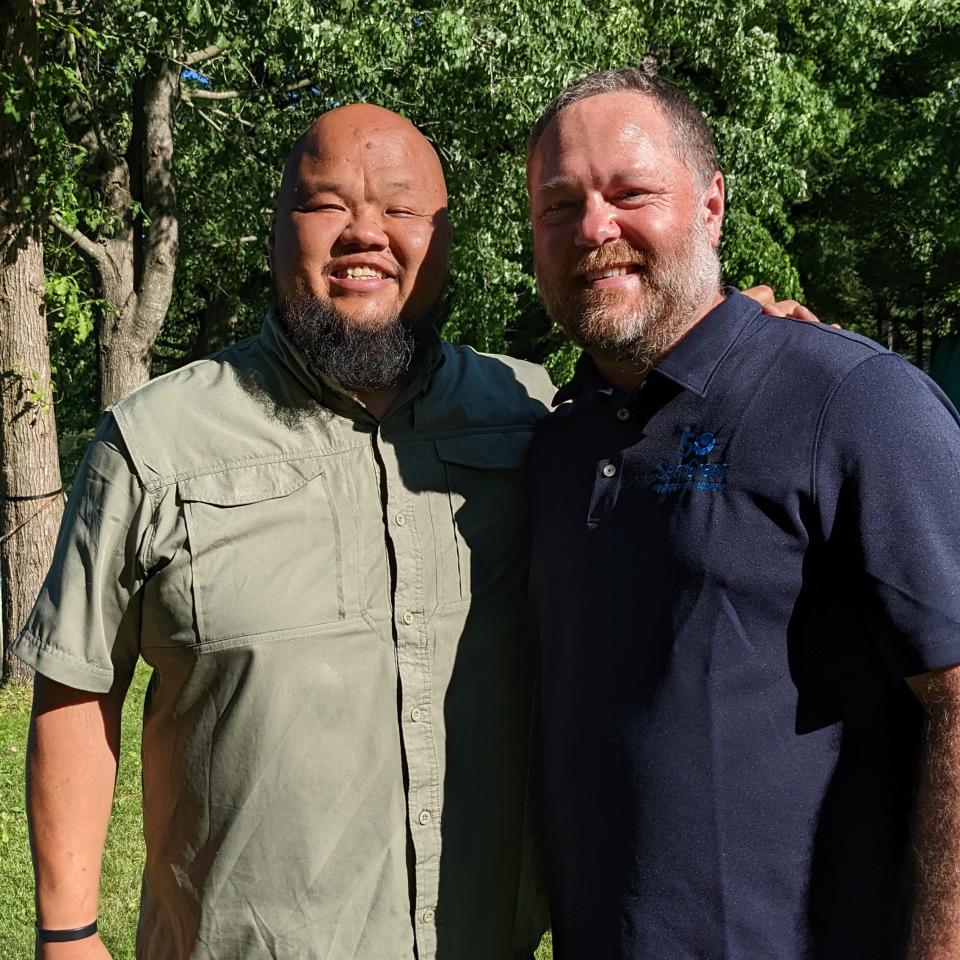 Chef Yia Vang and UW Sea Grant researcher Titus Seilheimer, who gathered and cooked invasive mystery snails together last summer.