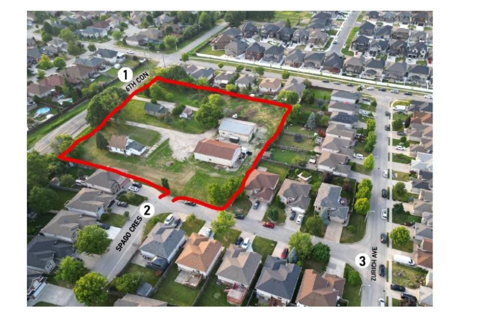 The two properties in the red square are where a developer wants to build a new townhouse subdivision. 