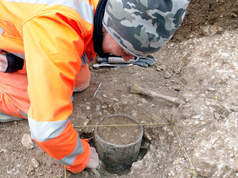 Late Bronze Age vessel being excavated south of Longbarrow Crossroads on the A303.JPG