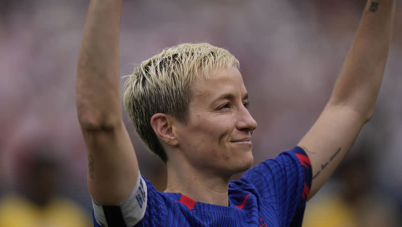 U.S. forward Megan Rapinoe waves to fans during a retirement ceremony before a soccer game against South Africa, Sunday, Sept. 24, 2023, in Chicago.