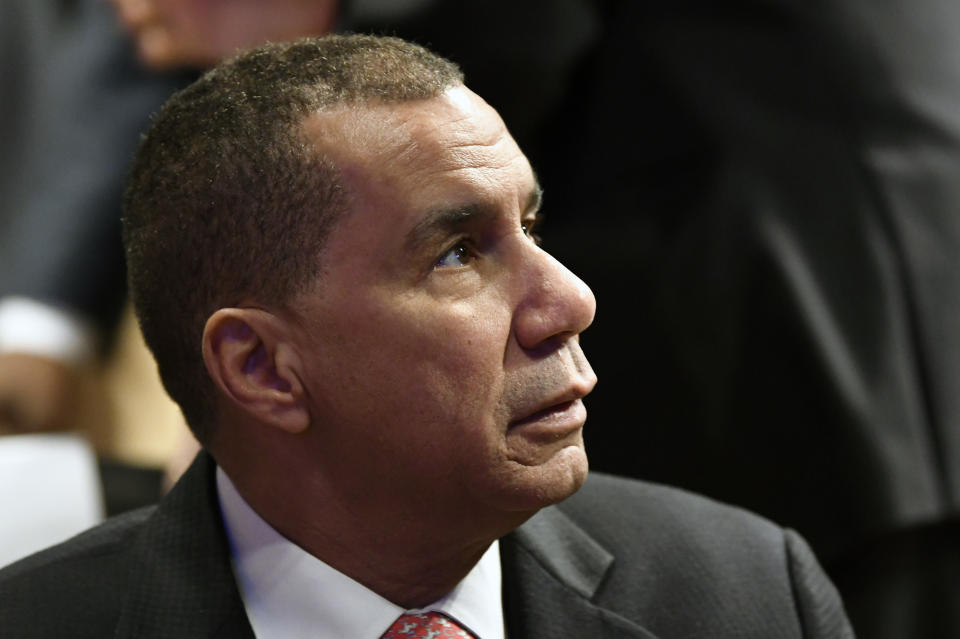 FILE - In this Jan. 3, 2018 file photo, former New York Gov. David Patterson waits for New York Gov. Andrew Cuomo to deliver his state of the state address at the Empire State Plaza Convention Center in Albany, N.Y. Paterson is joining Las Vegas Sands to lead the casino and resort developer's push for a casino in New York City. Voters have already authorized up to three casinos for the nation's largest city, but state law currently says they can't be approved until 2023 at the earliest. (AP Photo/Hans Pennink, File)