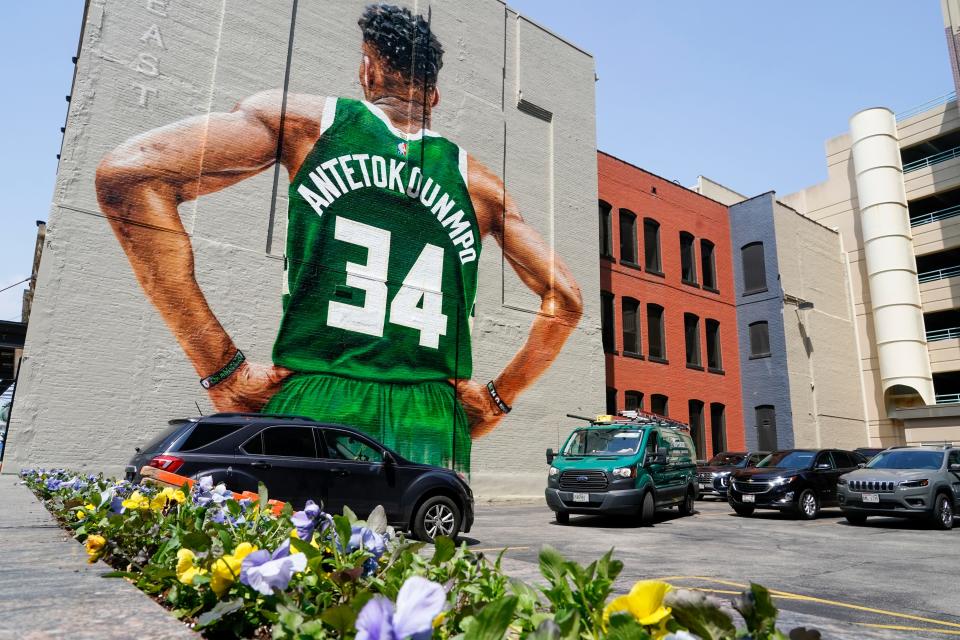 A mural of Bucks forward Giannis Antetokounmpo is seen painted on the side of a building Milwaukee.