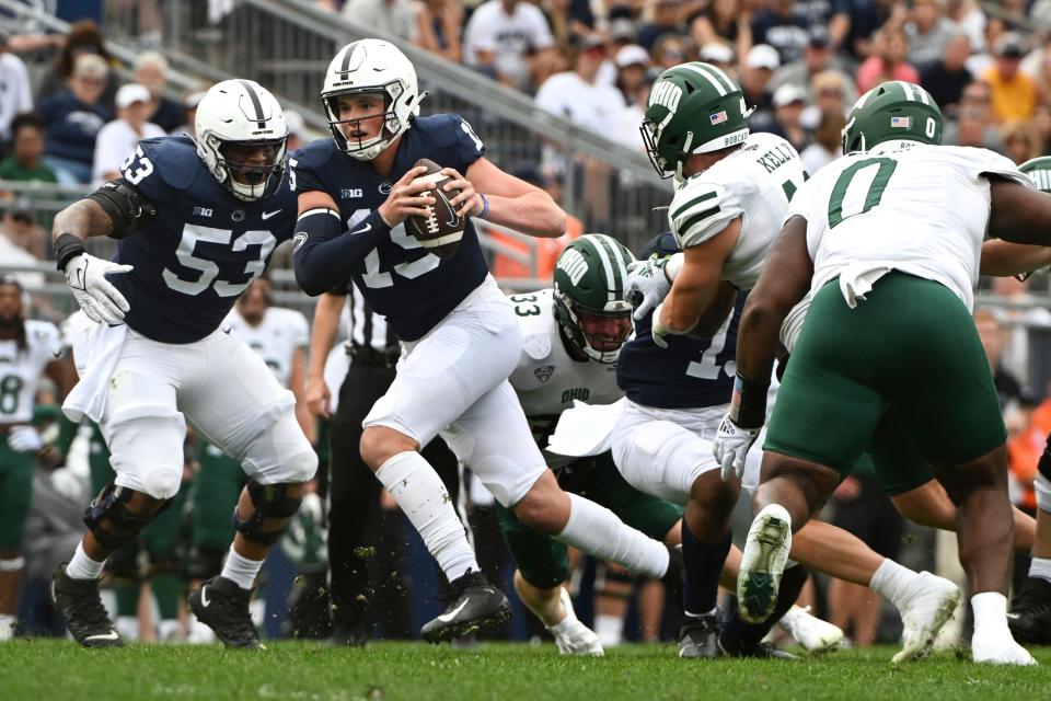 Penn State quarterback Drew Allar (15) scrambles away from Ohio linebacker Kyle Kelly (48) during the second half of an NCAA college football game , Saturday, Sept. 10, 2022, in State College, Pa. (AP Photo/Barry Reeger)