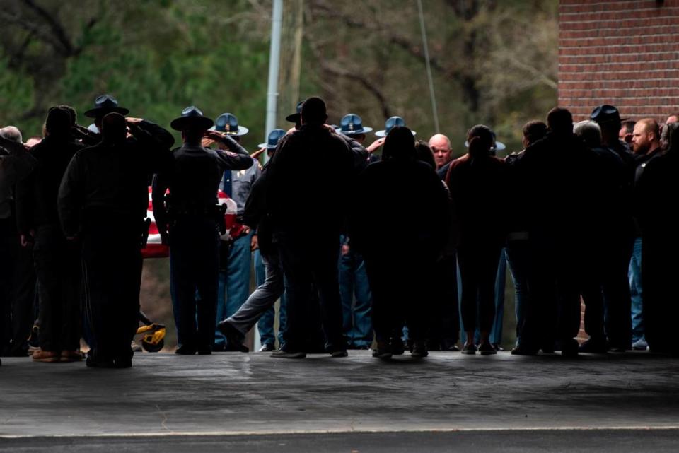 The body of Jeremy Malone, an officer with the George County Sheriff’s Office, is escorted into Moments Funeral Home in Lucedale on Friday, Jan. 5, 2024. Malone was killed on Thursday when conducting a traffic stop near a Dollar General. Hannah Ruhoff/Sun Herald