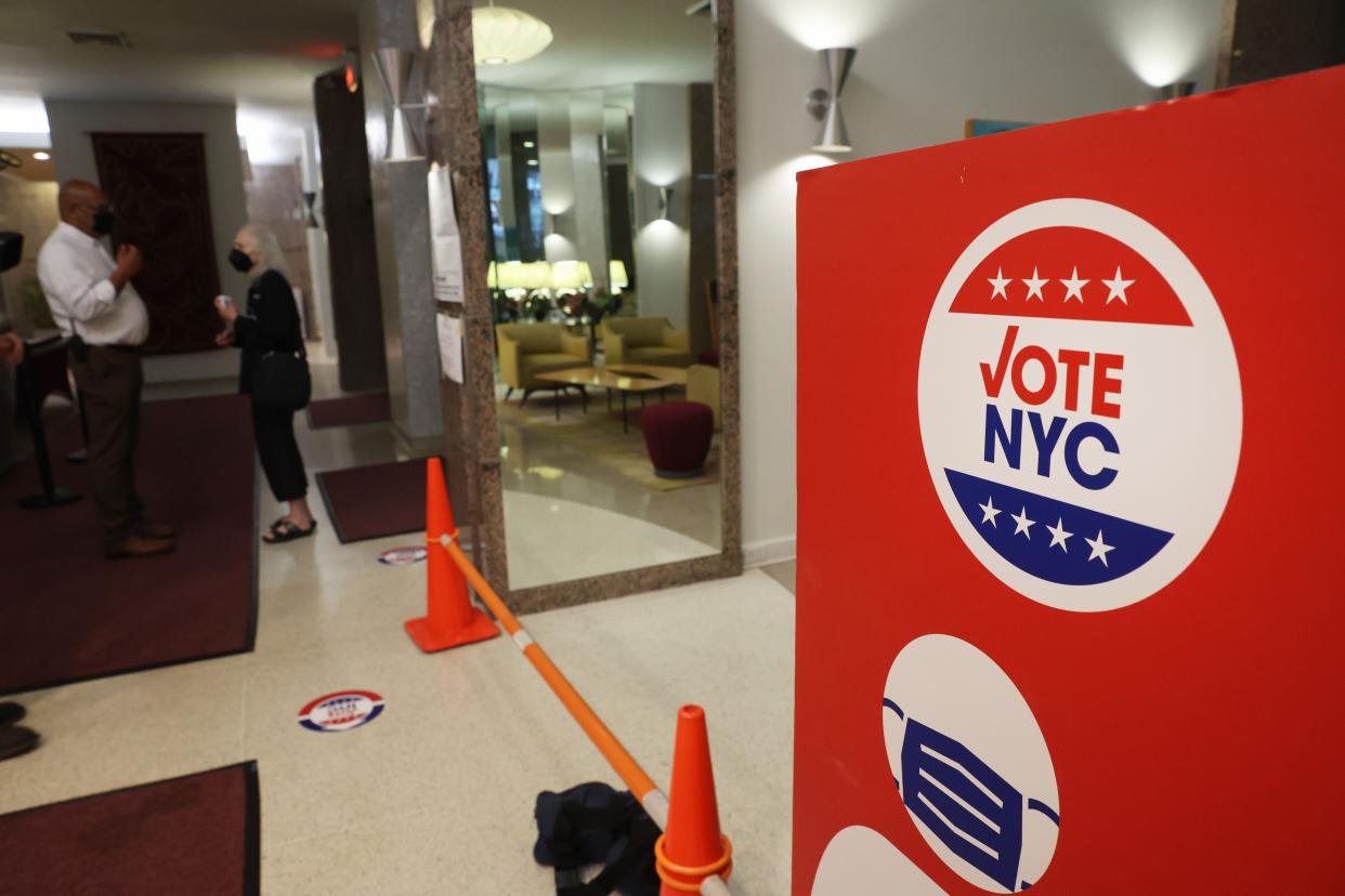 People vote in a polling station in a residential building in New York's 12th Congressional District on Aug. 23, 2022, in New York City. 