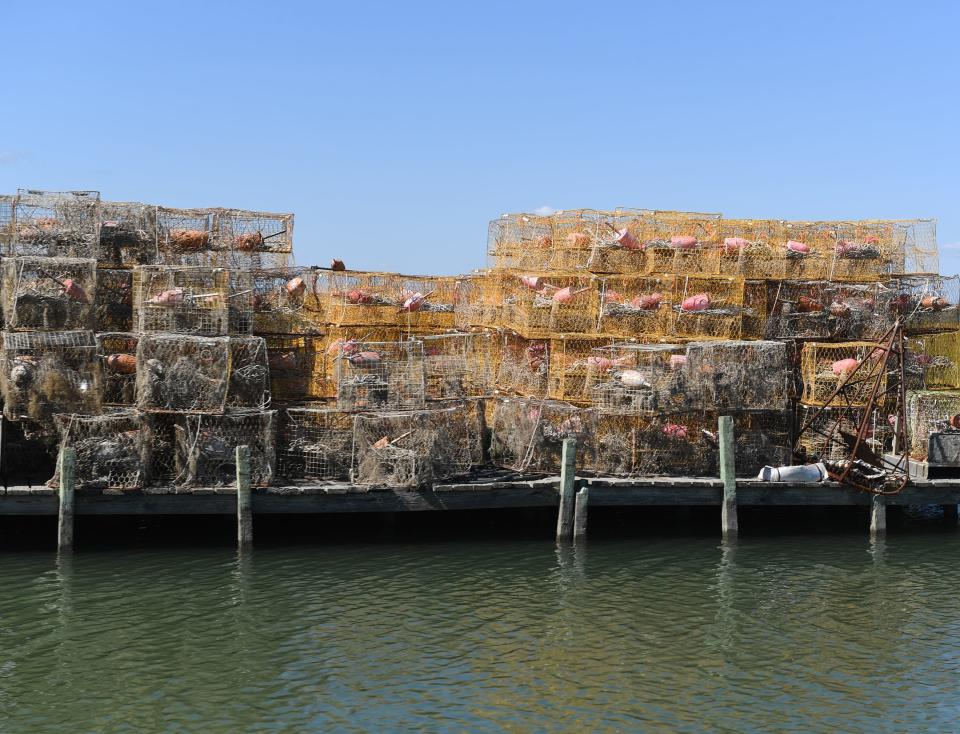 Crab pots are stacked on a dock Sept. 27, 2022, on Smith Island, Maryland.