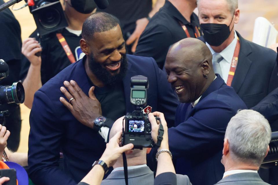 LeBron James and Michael Jordan share a laugh during the halftime ceremony honoring the NBA's 75th anniversary team.