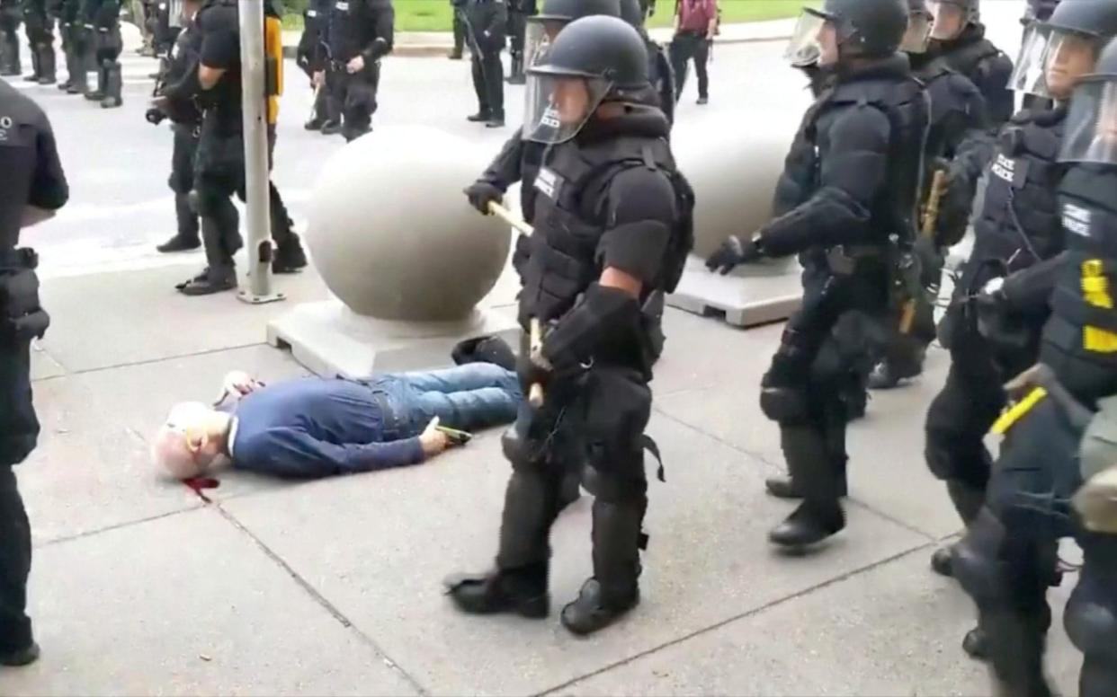 An elderly man bleeds after falling after appearing to be shoved by riot police in Buffalo during a protest against the death in Minneapolis police custody of George Floyd - WBFO/via Reuters