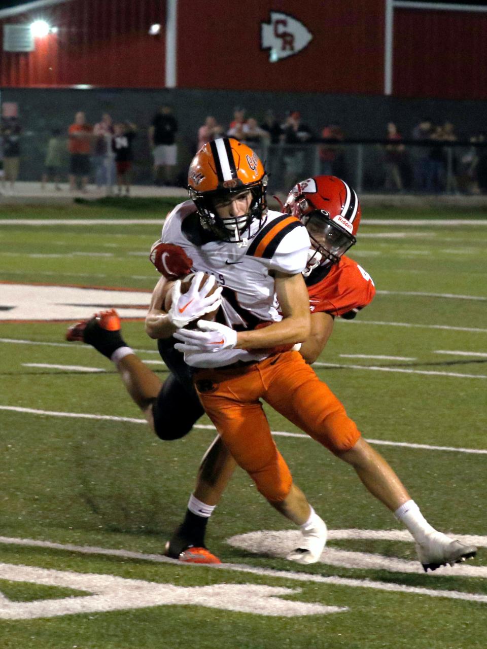 Antwaun Johns, of Coshocton, brings down Ridgewood's Matt Humphrey on Friday night at Stewart Field. Coshocton won, 42-14.