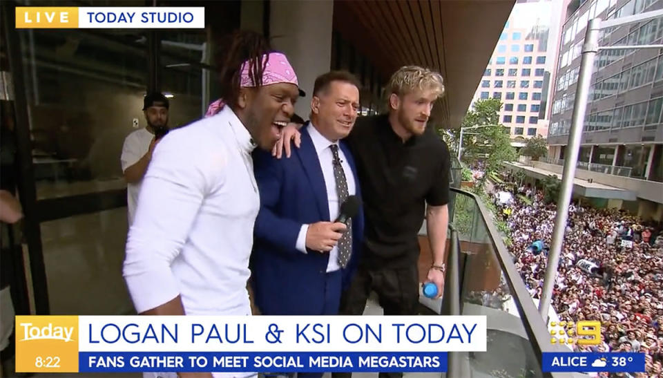 KSI, Karl Stefanovic and Logan Paul on the balcony looking at the crowd on the Today show