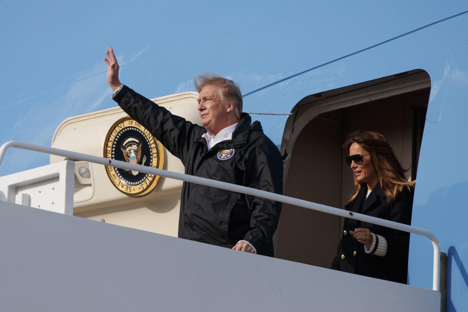 FILE - In this Friday, March 8, 2019 file photo, president Donald Trump and first lady Melania Trump arrive on Air Force One at Palm Beach International Airport, in West Palm Beach, Fla., en route to his Mar-a-Lago property in Palm Beach, Fla. On Friday, March 15, 2018, The Associated Press has found that a video circulating on the internet showing Trump not wearing a toupee was digitally manipulated to remove his hair. (AP Photo/Carolyn Kaster)